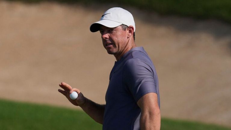 Rory McIlroy of Northern Ireland acknowledges the crowd after he playing his shot at the 12th green (AP Photo/Altaf Qadri)