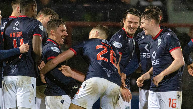 DINGWALL, SCOTLAND - NOVEMBER 23: Ross County's Josh Nisbet (L) celebrates scoring to make it 2-0 with teammates during a William Hill Premiership match between Ross County and Motherwell at the Global Energy Stadium on November 23, 2024, in Dingwall, Scotland. (Photo by Mark Scates / SNS Group)