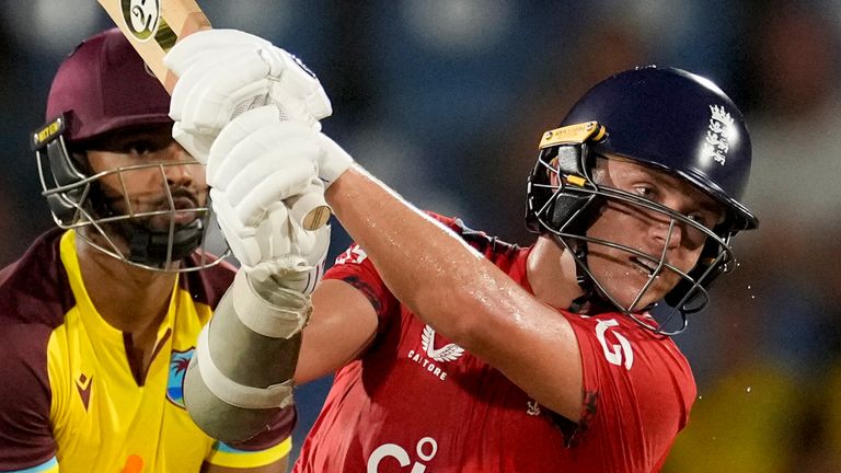 England's Sam Curran plays a shot for six runs from a delivery of West Indies' Gudakesh Motie during the third T20 cricket match at Daren Sammy National Cricket Stadium in Gros Islet, St. Lucia, Thursday, Nov. 14, 2024. (AP Photo/Ricardo Mazalan)