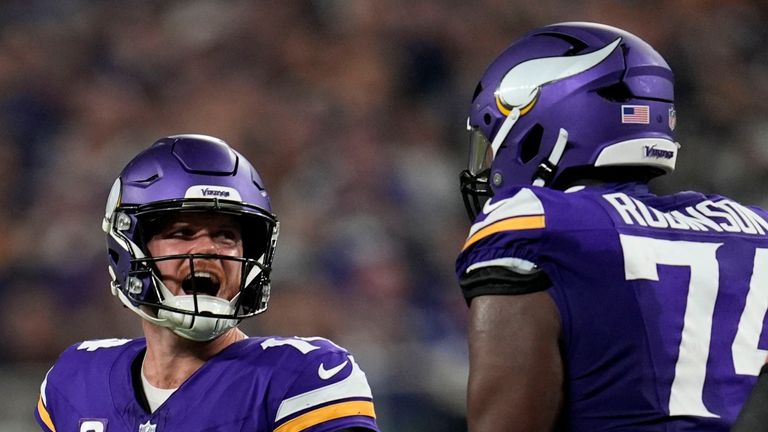 Minnesota Vikings quarterback Sam Darnold (14) celebrates after throwing a touchdown pass during the second half of an NFL football game against the Indianapolis Colts, Sunday, Nov. 3, 2024, in Minneapolis. (AP Photo/Abbie Parr) 