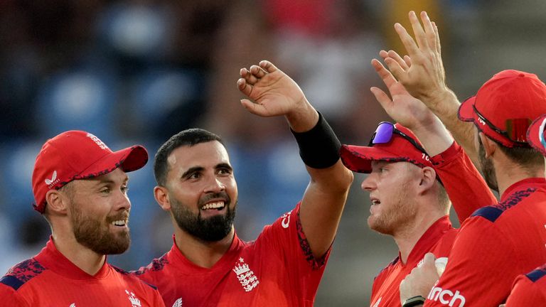 England's Saqib Mahmood and Phil Salt (Associated Press)