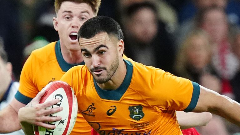 Tom Wright scored a hat-trick of tries for Australia in their dominant win over Wales in Cardiff