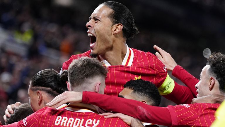 Virgil Van Dijk (middle) celebrates Liverpool's opening goal