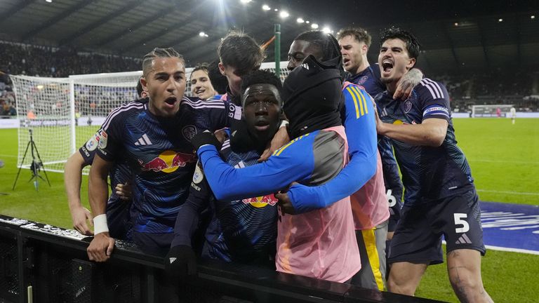 Wilfried Gnonto is mobbed by his Leeds team-mates after scoring their fourth goal