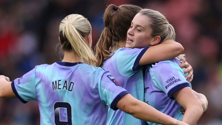 Alessia Russo celebrates with her team-mates after firing Arsenal in front against Manchester United