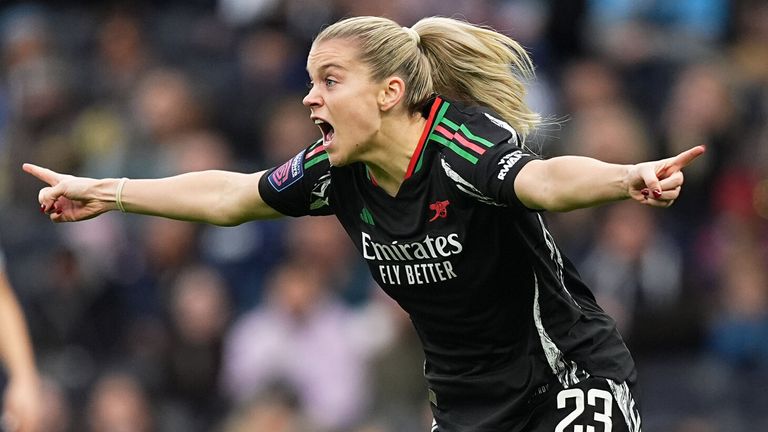 Alessia Russo celebrates after firing Arsenal into an early lead at Spurs