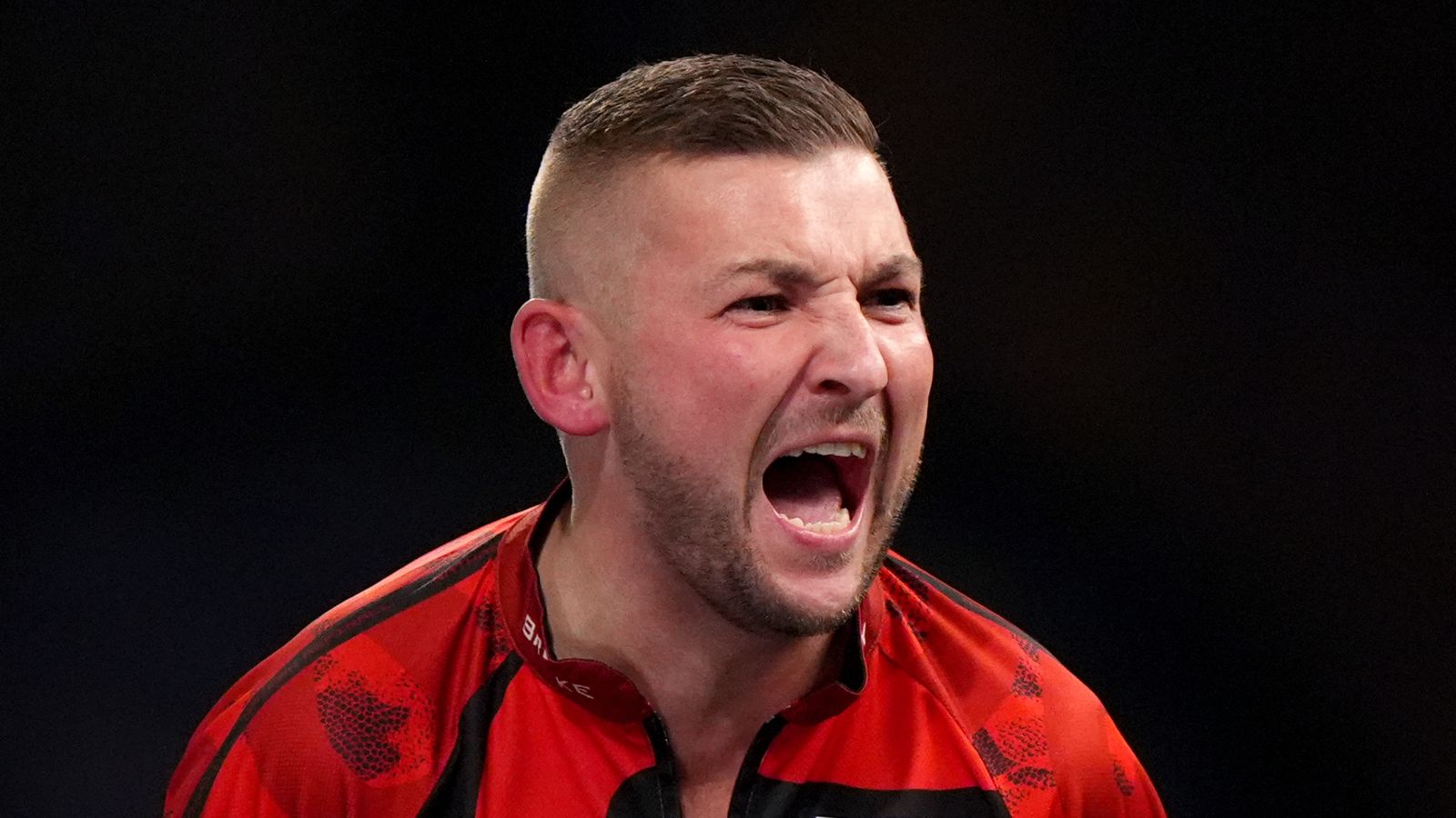 World Darts Championship: Nathan Aspinall earns nervy win as Christian Kist hits nine-darter in defeat | Darts News