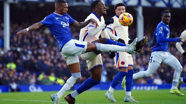 Everton's Ashley Young (left) and Chelsea's Axel Disasi battle for the ball