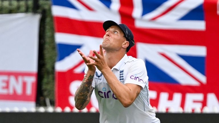 England's Brydon Carse takes a catch to dismiss New Zealand's Glenn Phillips