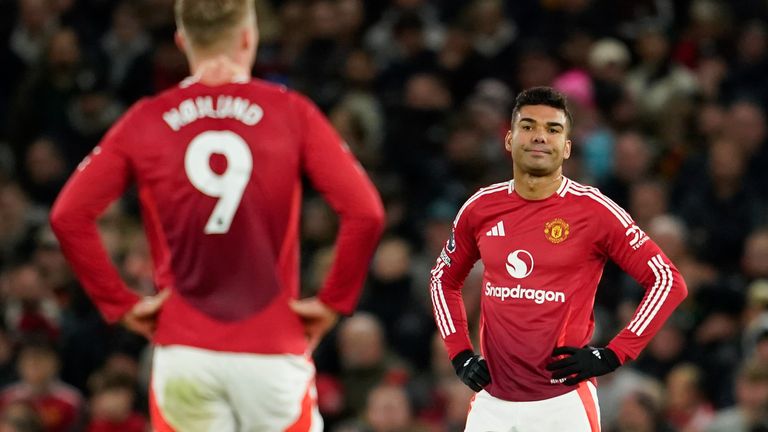 Casemiro and Rasmus Hojlund react after Newcastle's Joelinton makes it 2-0 to the away side (AP Photo/Dave Thompson)