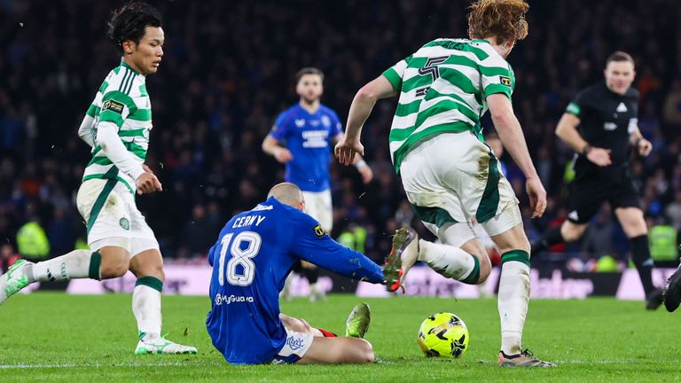 Celtic's Liam Scales tackles Rangers' Vaclav Cerny to the ground on the edge of the penalty area 