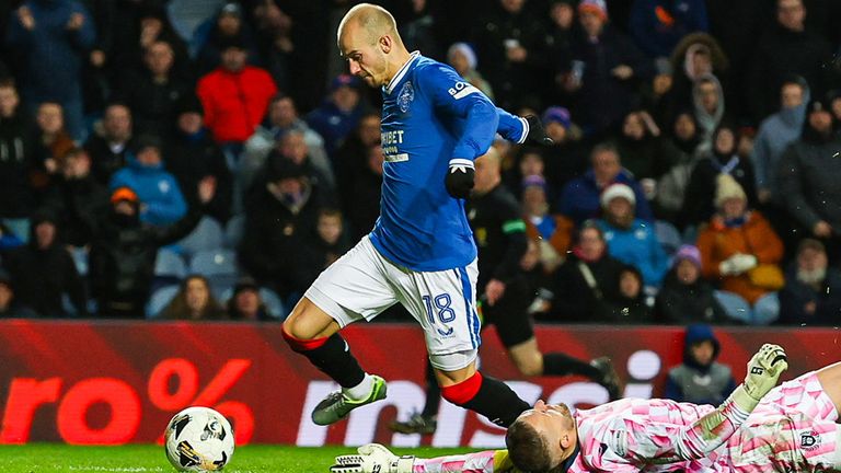 Rangers' Vaclav Cerny gets around Dundee's Trevor Carson to open the scoring