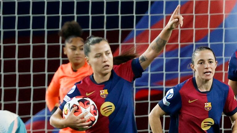 Barcelona's Claudia Pina, foreground left, celebrates after scoring the first goal during the Women's Champions League Group D soccer match between FC Barcelona and Manchester City at the Olympic Stadium in Barcelona, Spain, Wednesday, December 18, 2024. (AP Photo/Joan Monfort)