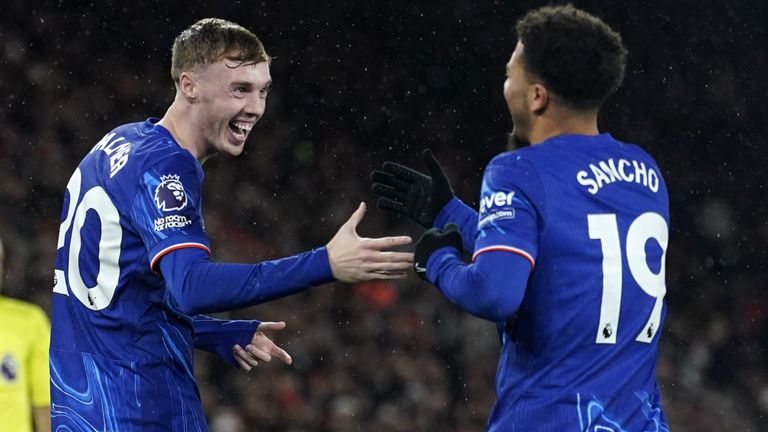 Chelsea's Cole Palmer celebrates scoring their side's fourth goal of the game with Jadon Sancho