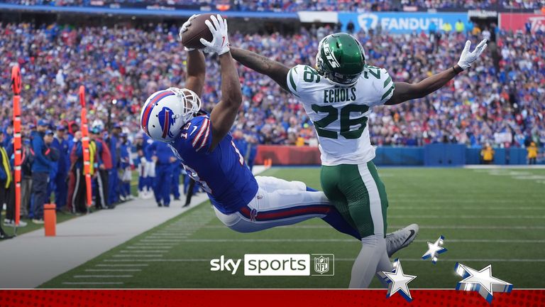 Buffalo Bills wide receiver Amari Cooper (18) catches a pass for a touchdown in front of New York Jets cornerback Brandin Echols (26) during the second half of an NFL football game, Sunday, Dec. 29, 2024, in Orchard Park, N.Y.