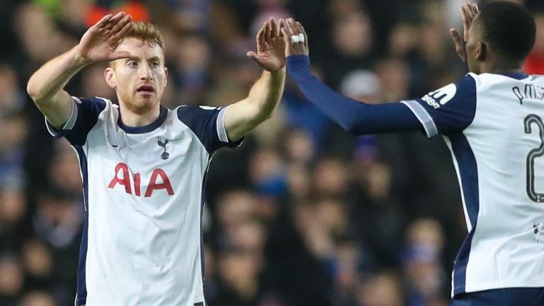 Tottenham's Dejan Kulusevski, left, celebrates with Tottenham's Pape Matar Sarr after scoring his side's first goal during the Europa League opening phase soccer match between Glasgow Rangers and Tottenham Hotspur at Ibrox stadium in Glasgow, Thursday, Dec. 12, 2024. (AP Photo/Scott Heppell)