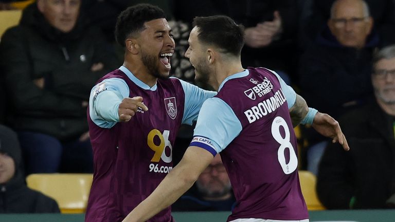 Josh Brownhill celebrates with team-mate Josh Laurent after giving Burnley the lead at Norwich