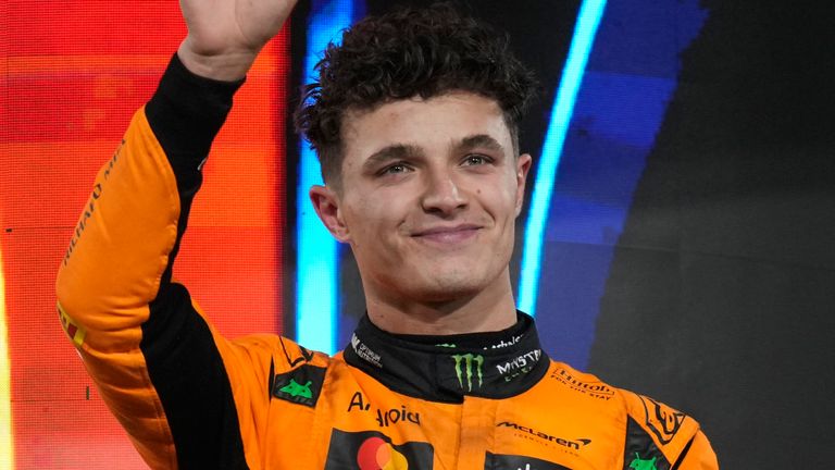 McLaren driver Lando Norris of England stands on the podium after winning the Formula One Abu Dhabi Grand Prix at the Yas Marina Circuit in Abu Dhabi, United Arab Emirates, Sunday, December 8, 2024. (AP Photo/ Darko Bandic)