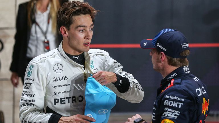 LOSAIL INTERNATIONAL CIRCUIT, QATAR - NOVEMBER 30: Pole man Max Verstappen, Red Bull Racing, and George Russell, Mercedes-AMG F1 Team, talk in Parc Ferme during the Qatar GP at Losail International Circuit on Saturday November 30, 2024 in Losail, Qatar. (Photo by Dom Romney / LAT Images)