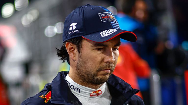 LOSAIL INTERNATIONAL CIRCUIT, QATAR - DECEMBER 01: Sergio Perez, Red Bull Racing, makes his way to the grid for the national anthem during the Qatar GP at Losail International Circuit on Sunday December 01, 2024 in Losail, Qatar. (Photo by Sam Bloxham / LAT Images)