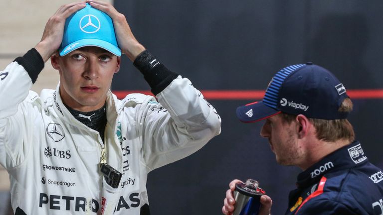 LOSAIL INTERNATIONAL CIRCUIT, QATAR - NOVEMBER 30: Pole man Max Verstappen, Red Bull Racing, and George Russell, Mercedes-AMG F1 Team, talk in Parc Ferme during the Qatar GP at Losail International Circuit on Saturday November 30, 2024 in Losail, Qatar. (Photo by Dom Romney / LAT Images)