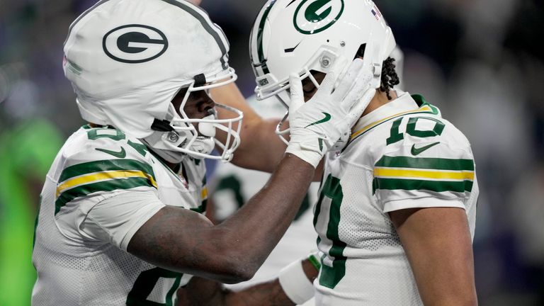 Green Bay Packers' Romeo Doubs celebrates touchdown with Jordan Love 