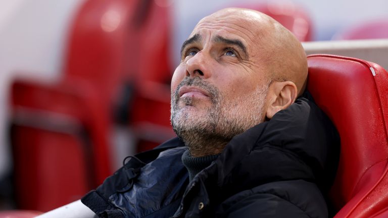 Manchester City's head coach Pep Guardiola sits on the bench before the English Premier League soccer match between Liverpool and Manchester City at Anfield Stadium, Liverpool, England, Sunday Dec. 1, 2024. (AP Photo/Ian Hodgson)