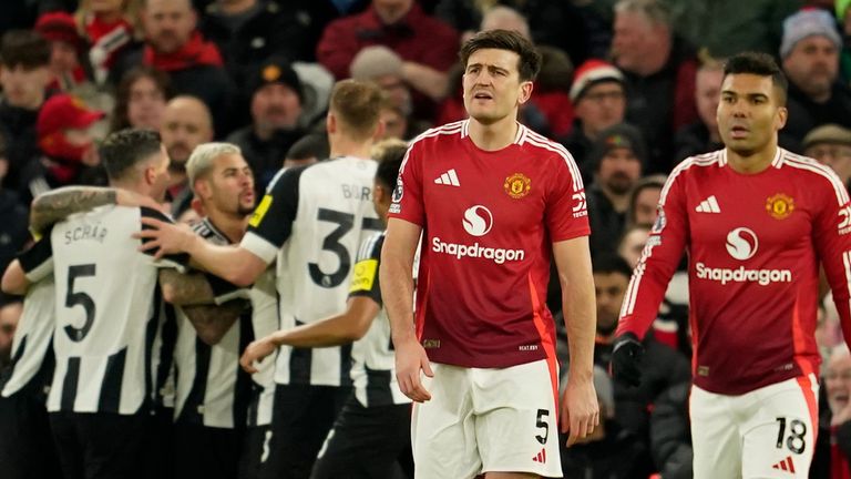 Harry Maguire and Casemiro react after Newcastle's Alexander Isak scores the opening goal (AP Photo/Dave Thompson)