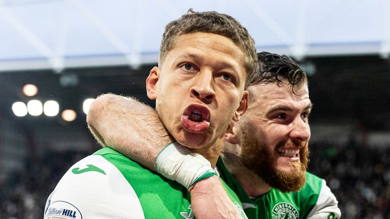 EDINBURGH, SCOTLAND - DECEMBER 26: Hibernian's Dwight Gayle celebrates with Nicky Cadden as he scores to make it 2-1 during a William Hill Premiership match between Heart of Midlothian and Hibernian at Tynecastle Park, on December 26, 2024, in Edinburgh, Scotland. (Photo by Mark Scates / SNS Group)