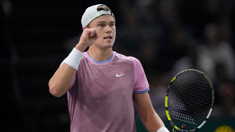 Denmark's Holger Rune reacts after winning a point as he plays Alex de Minaur, of Australia, during their quarterfinal match of the Paris Masters tennis tournament at the Accor Arena, Friday, Nov. 1, 2024 in Paris. (AP Photo/Michel Euler)