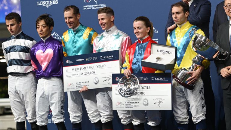 Mickael Barzalona representing France after receiving the trophy for winning the jockey champion poses along side runner ups Hollie Doyle and James McDonald during the 2024 LONGINES International Jockeys' Championship at Happy Valley Racecourse 