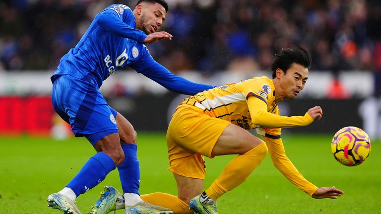 Leicester City's James Justin (left) and Brighton 's Kaoru Mitoma battle for the ball