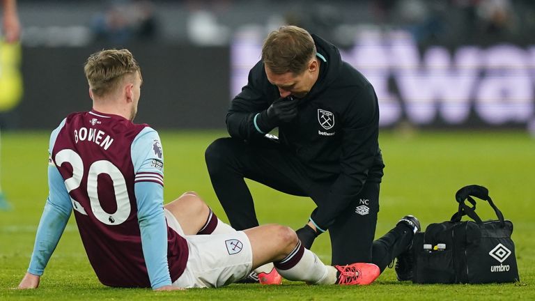 Jarrod Bowen receives treatment to his left foot during West Ham's defeat to Liverpool on Sunday