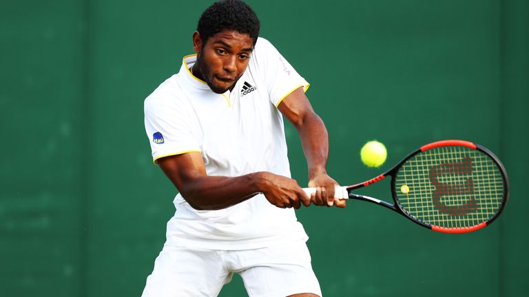 Joao Lucas Reis Da Silva of Brazil plays a backhand in his Boys' Singles first round match on day seven of the Wimbledon Lawn Tennis Championships at All England Lawn Tennis and Croquet Club on July 9, 2018 in London, England. (Photo by Michael Steele/Getty Images)