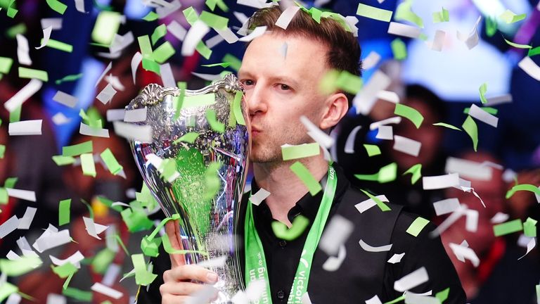 Judd Trump celebrates with the UK Snooker Championship trophy for the second time