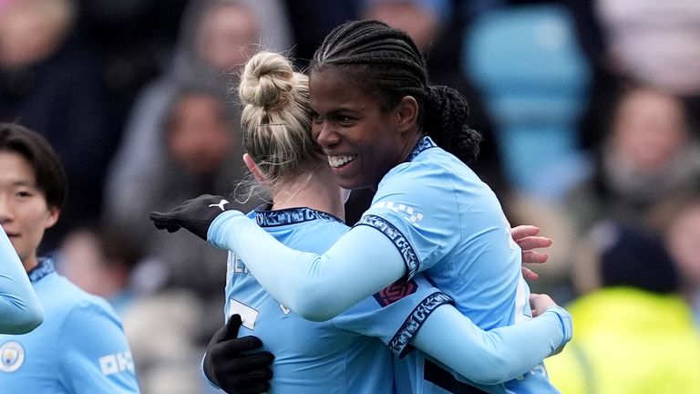 Khadija Shaw celebrates with Alex Greenwood after scoring