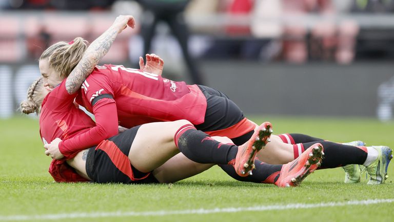 Leah Galton is congratulated by team-mate Elisabeth Terland after scoring Man Utd's second goal