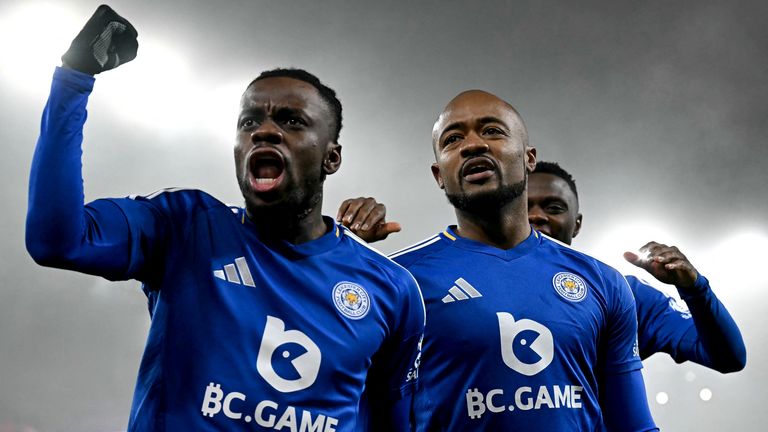 Leicester players celebrate after Jordan Ayew's opener at Liverpool