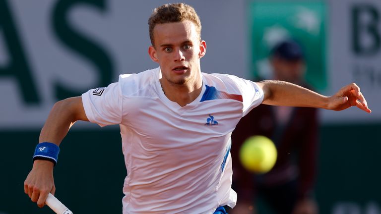 Luca Van Assche of France returns the ball as he plays against Denis Shapovalov of Canada during their first round match of the French Open tennis tournament at the Roland Garros stadium in Paris, Monday, May 27, 2024. (AP Photo/Jean-Francois Badias)