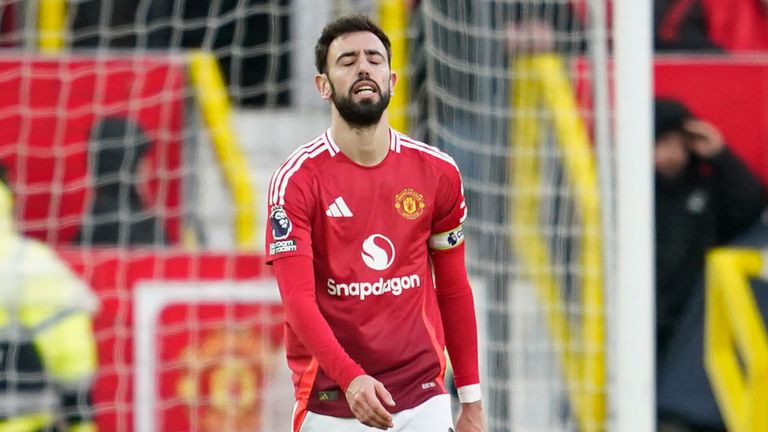 Manchester United's Bruno Fernandes is dejected after his team conceded a third