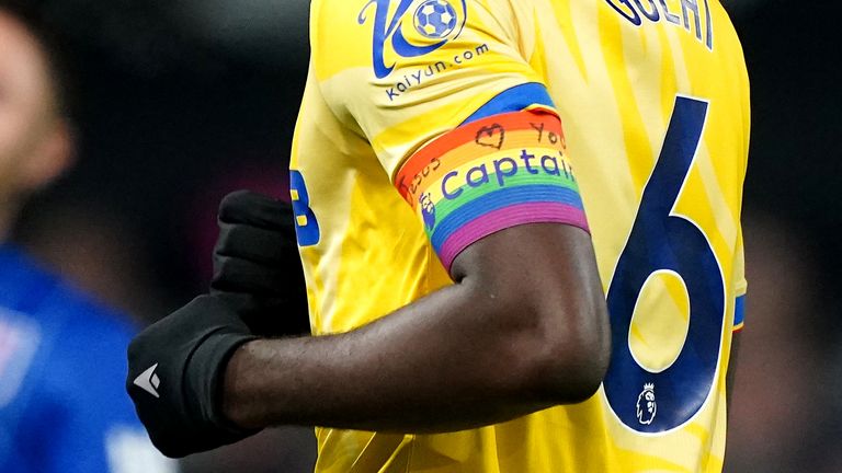 Crystal Palace captain Marc Guehi wears the Rainbow Laces armband with the words 'Jesus Heart You' written across it