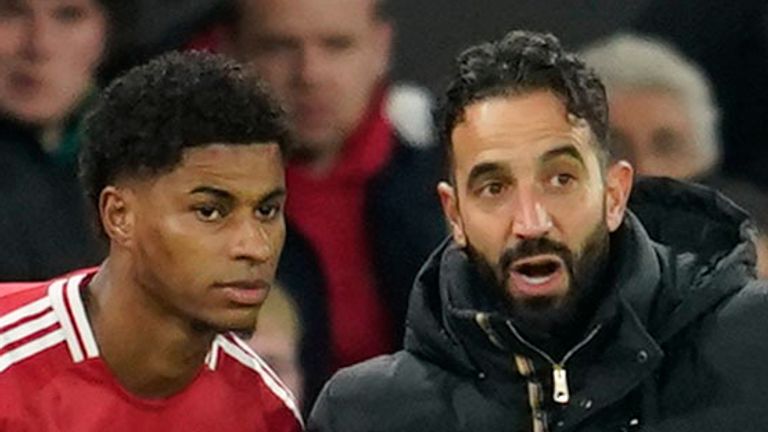 Manchester United head coach Ruben Amorim, right, gives instructions to Manchester United's Marcus Rashford during the Europa League opening round soccer match between Manchester United and Bodo Glimt at the Stadium Old Trafford in Manchester, England, Thursday, Nov. 28, 2024. (AP Photo/Dave Thompson)