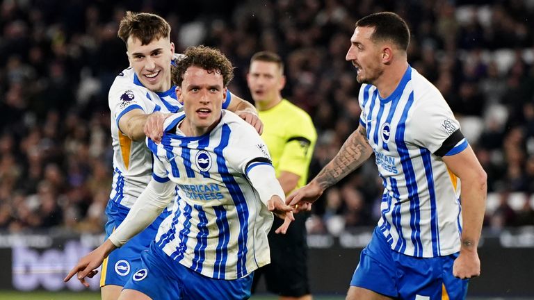 Mats Wieffer (centre) celebrates with team-mates after scoring his side's first goal of the game