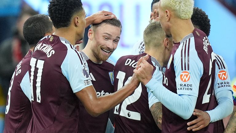 Matty Cash celebrates Villa's third goal with team-mates