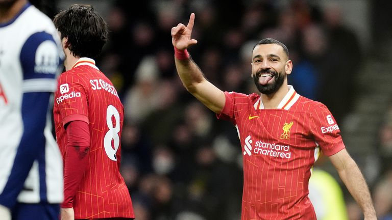 Liverpool's Mohamed Salah (right) celebrates scoring their fourth goal of the game 