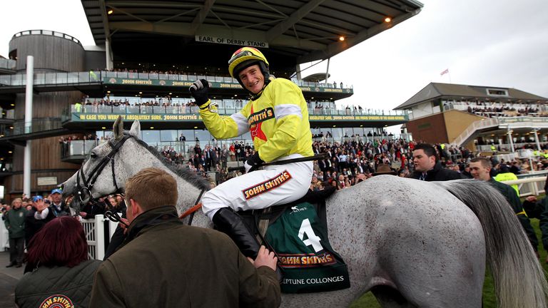 Jacob celebrates after winning the 2012 Grand National on Neptune Collonges 