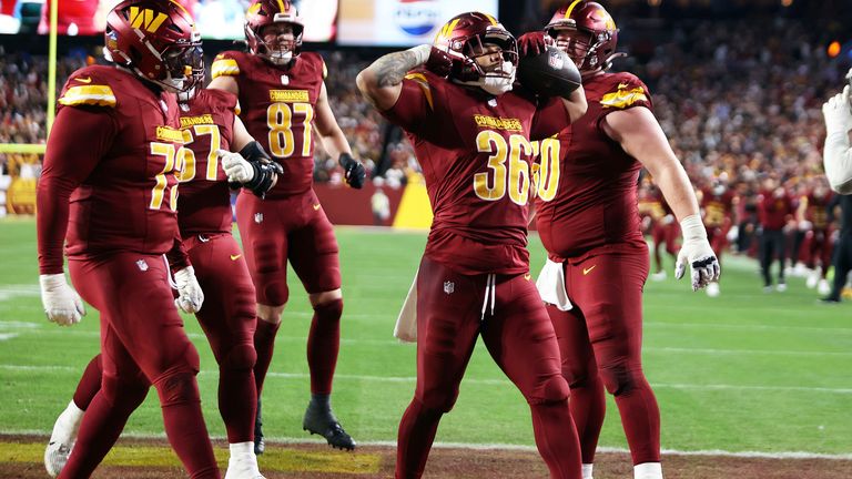 Washington Commanders running back Chris Rodriguez Jr. (36) celebrates after scoring a touchdown during an NFL football game against the Atlanta Falcons, Sunday, Dec. 29, 2024 in Landover, Md. (AP Photo/Daniel Kucin Jr.)