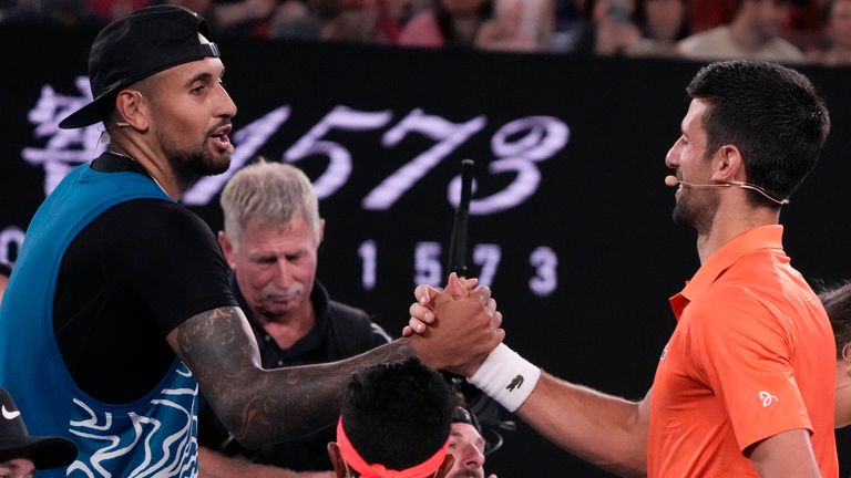 Australia's Nick Kyrgios, left, and Serbia's Novak Djokovic shake hands following an exhibition match on Rod Laver Arena ahead of the Australian Open tennis championship in Melbourne, Australia, Friday, Jan. 13, 2023. (AP Photo/Mark Baker)