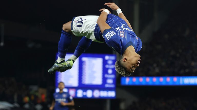 Omari Hutchinson celebrates by performing a backflip after doubling Ipswich's lead  (AP Photo/Richard Pelham)