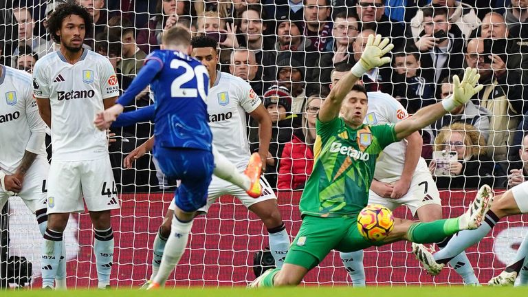 Cole Palmer's free-kick is saved by Emi Martinez